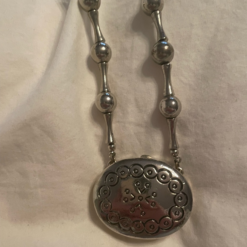 Vintage Estée Lauder necklace/perfume holder, moonsilver